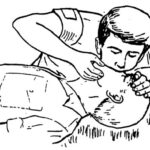 Figure 3-7. Administering mouth-to-nose breathing.