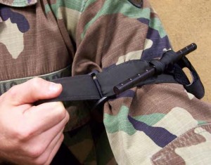 Figure 2-15. Pull the free-running end of the self-adhering band tight and securely fasten it back on itself.