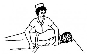 Figure 2-10. Turning a patient on his side.