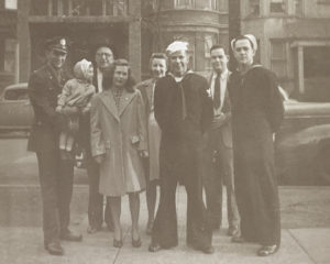 Tom holding Karen, Doctor Cartmell, Zoe Foran, Elaine, Bill Van Meter, Stanley, and Boyd McCracken, Sunday, April 23, 1944, Chicago, Illinois