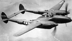 Lockheed P-38H-5-LO in flight (S/N 42-67079) with Red Surround Insignia. (U.S. Air Force photo)