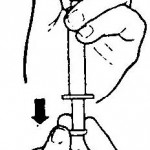 Figure 1-8. Withdrawing medication with vial inverted.