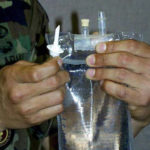 Figure 1-8. Preparing to “spike” IV bag
