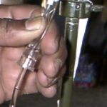 Adjusting the flow of an IV solution