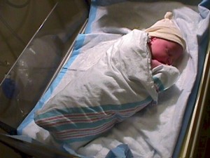 Newborn wrapped for heat retention