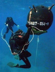 Divers working on an underwater mine.