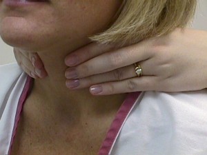 Palpate the thyroid gland