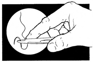 Figure 2-5. Grasping the suture needle with the suture holder.