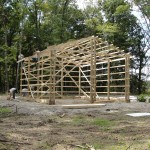 Pre-built roof trusses are in place and purlins attached.